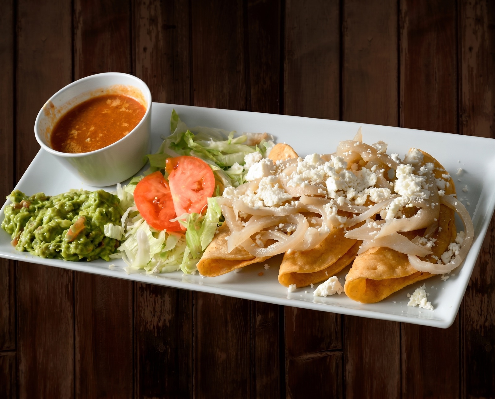 Combination plate with enchilada, rice, beans and more